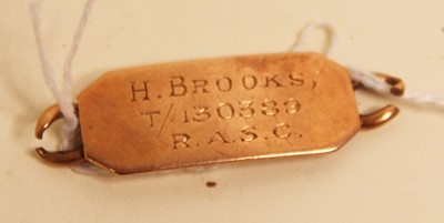 Lot 355 - A 9ct gold identity tag, annotated to both...