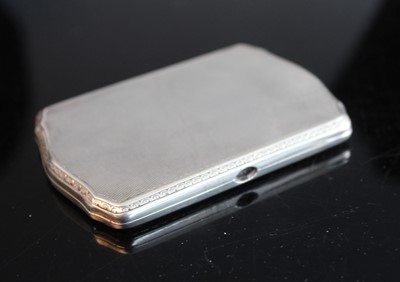 Lot 372 - An engine turned silver pocket cigarette case,...