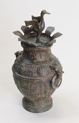 Lot 8 - A Chinese mixed metal lidded urn, surmounted...