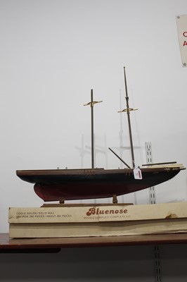 Lot 12 - A French 'bluenose' wooden model of a ship,...