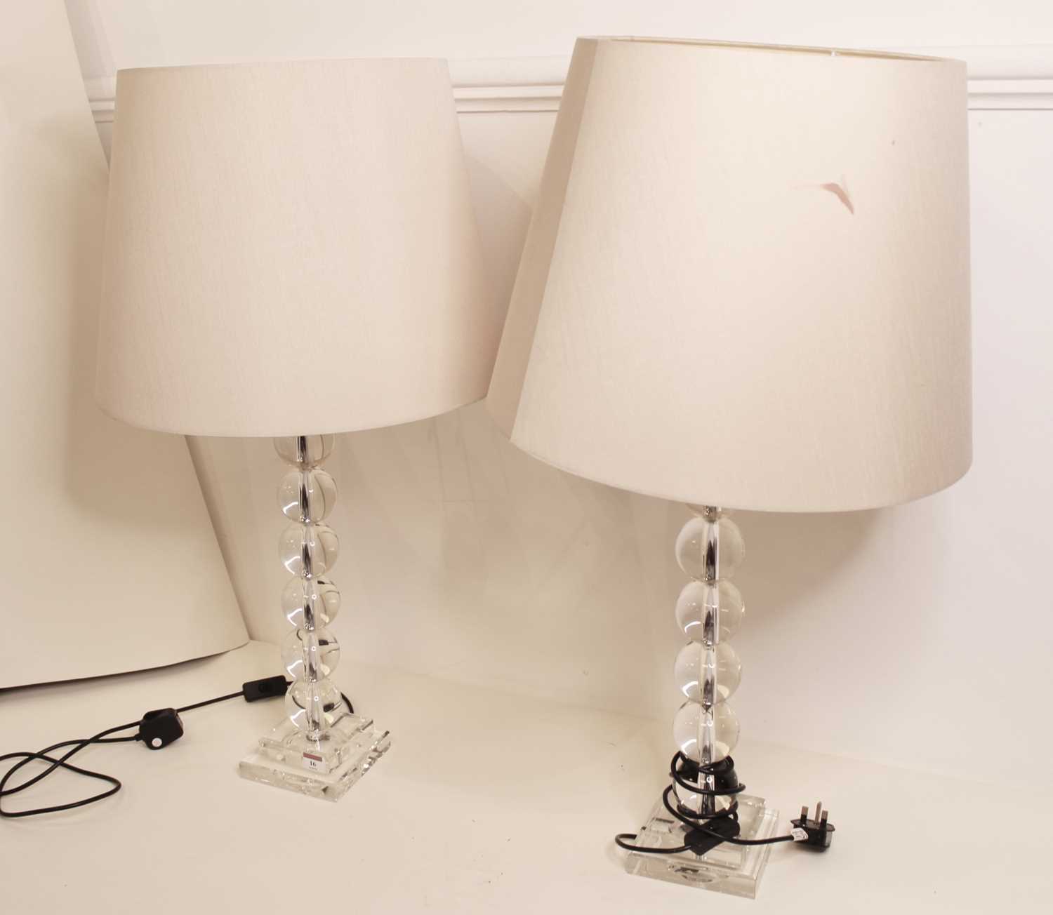 Lot 16 - A pair of modern glass table lamps, of beaded...