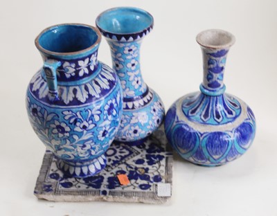Lot 30 - An Iznik style blue glazed twin handled urn,...