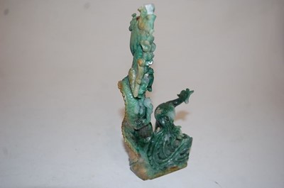 Lot 48 - A Japanese carved green hardstone model of...
