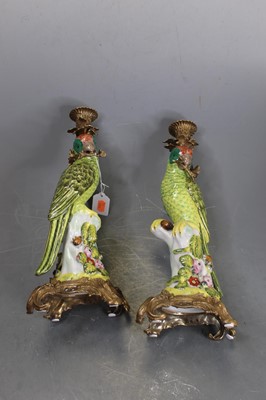 Lot 59 - A pair of continental porcelain and brass...