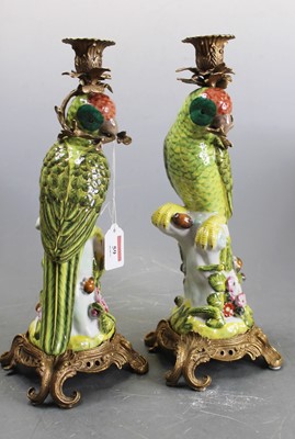 Lot 59 - A pair of continental porcelain and brass...