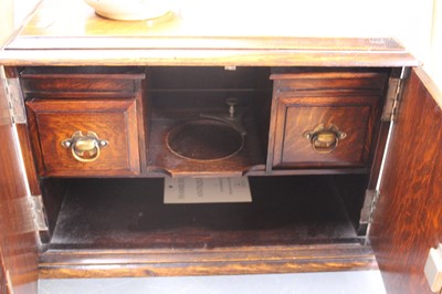 Lot 63 - An early 20th century oak smoker's cabinet,...