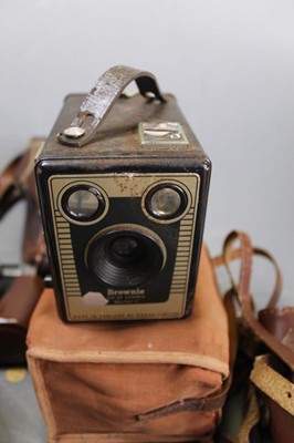 Lot 68 - A box containing a collection of cameras and...