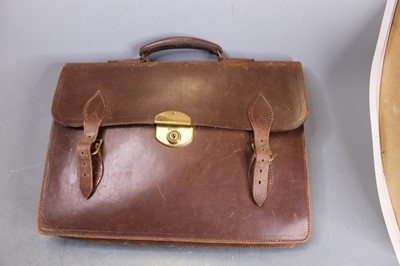 Lot 76 - A brown leather bag containing a collection of...