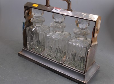 Lot 118 - A mid-20th century silver plated three-bottle...