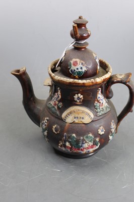 Lot 124 - A late Victorian bargeware treacle glazed...