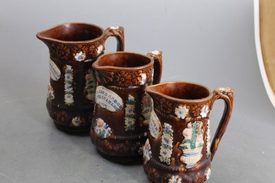 Lot 124 - A late Victorian bargeware treacle glazed...