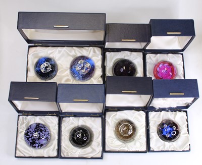 Lot 166 - A collection of eight glass paperweights, to...
