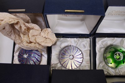Lot 170 - A collection of eight glass paperweights, to...