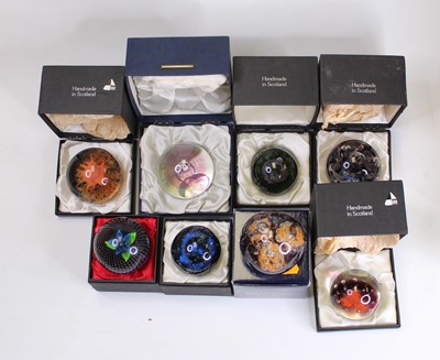 Lot 171 - A collection of eight glass paperweights, to...