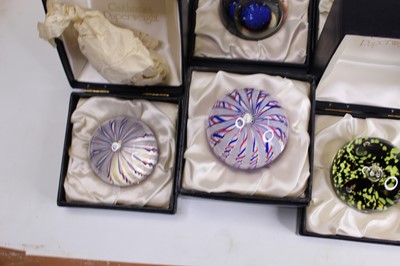 Lot 172 - A collection of eight glass paperweights, to...