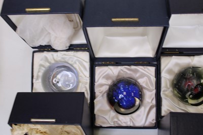 Lot 172 - A collection of eight glass paperweights, to...