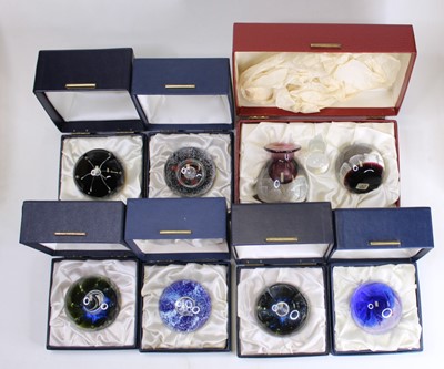 Lot 174 - A collection of eight glass paperweights to...