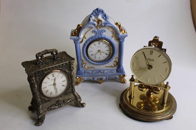 Lot 187 - An early 20th century oak cased mantel clock,...