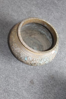 Lot 193 - An Eastern brass bowl, of squat circular form;...