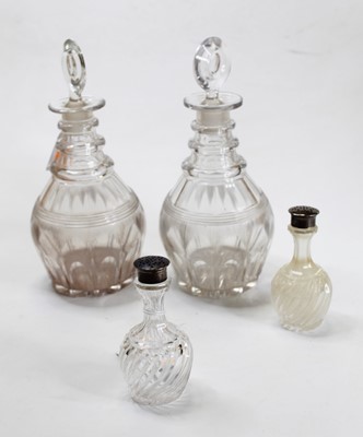 Lot 219 - A pair of Regency triple neck decanters, each...