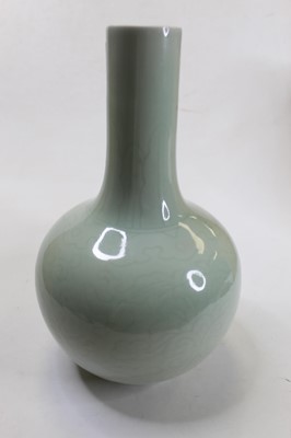 Lot 251 - A Chinese export celadon glazed bottle vase,...