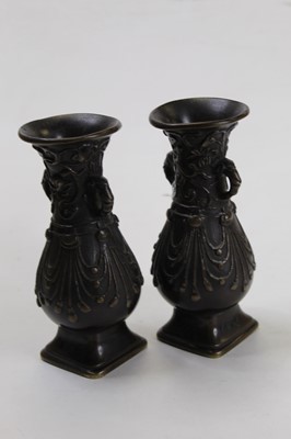 Lot 267 - A pair of bronze vases each having a flared...
