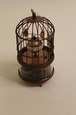 Lot 274 - A reproduction singing bird in cage clock...