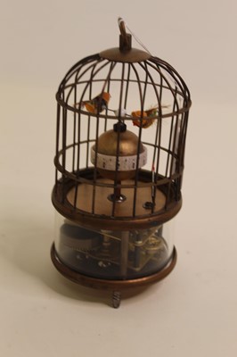 Lot 274 - A reproduction singing bird in cage clock...