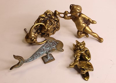 Lot 297 - A modern brass door-knocker in the form of a...