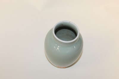 Lot 278 - A Chinese export celadon glazed vase of squat...