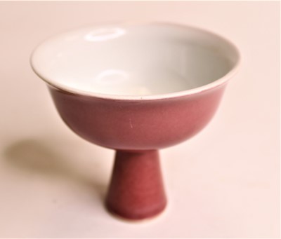 Lot 282 - A Chinese export oxblood glazed stem cup of...