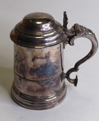 Lot 304 - A 19th century silver plated tankard, the lid...