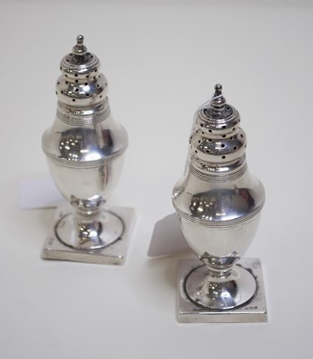 Lot 458 - A pair of George V silver pedestal cruets,...