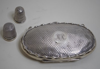 Lot 477 - A George V lady's silver purse of oval form...