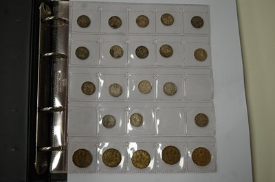 Lot 510 - A folder of coins to include Goerge V...