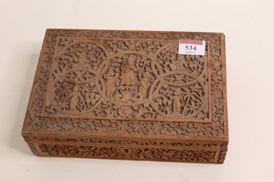 Lot 534 - An Indian carved sandalwood box containing a...