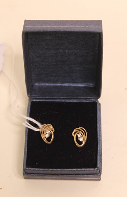 Lot 406 - A pair of ladies yellow metal and CZ set stud...