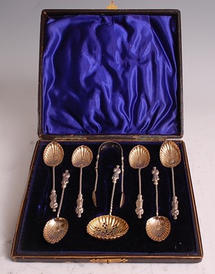 Lot 1050 - A late Victorian cased silver-gilt eight-piece...