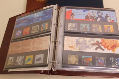 Lot 644 - An album of Royal Mail stamp presentation sets...