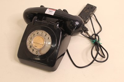 Lot 681 - A mid-20th century bakelite cased telephone