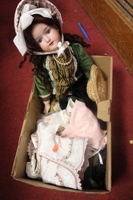 Lot 720 - An Armand Marseilles bisque headed doll...