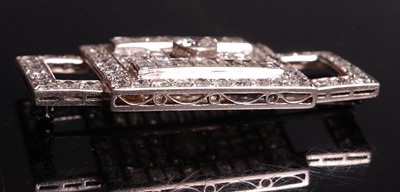 Lot 1108 - A white metal Art Deco diamond panel brooch,...