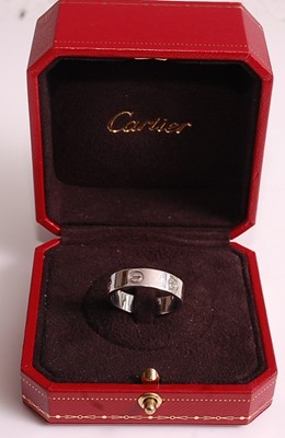 Lot 1109 - An 18ct white gold Cartier Love ring, width...