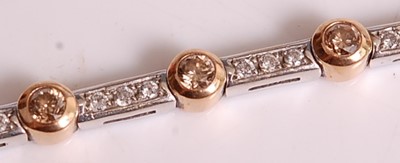 Lot 1123 - An 18ct white and rose gold diamond line...