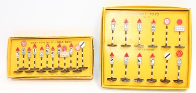 Lot 1011 - Two Dinky Toys sets of early road signs as...