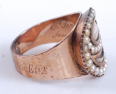 Lot 2529 - A rose metal mourning ring, featuring an oval...