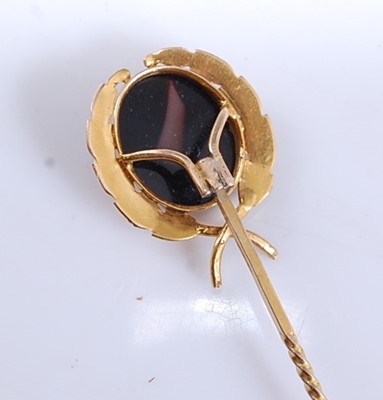 Lot 2535 - A yellow metal hardstone cameo stick pin,...