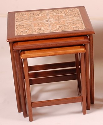 Lot 424 - A 1960s G-Plan teak and tile-top inset nest of...