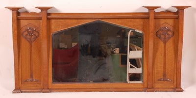 Lot 382 - An Art Nouveau oak framed bevelled overmantel...