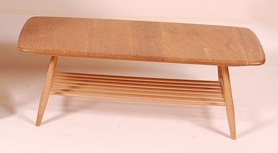 Lot 406 - An Ercol blond elm low coffee table, having...